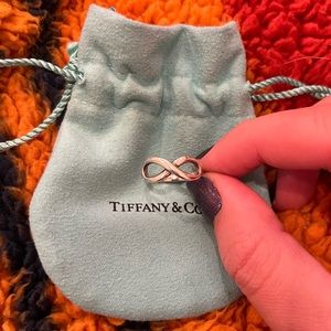 Authentic Tiffany and Co. infinity ring in sterling silver, size 5